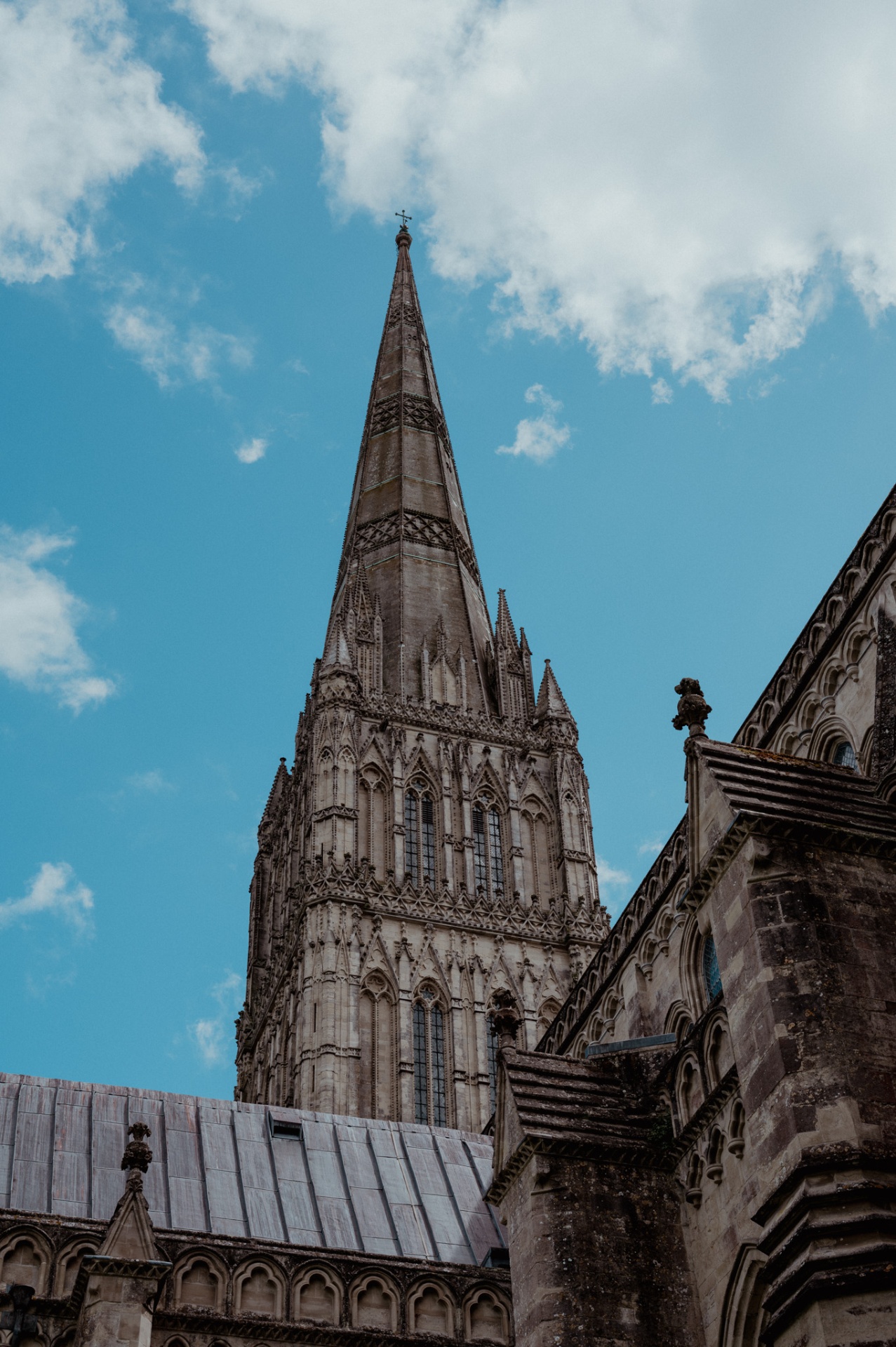 Cathedral spire rising into a blue sky