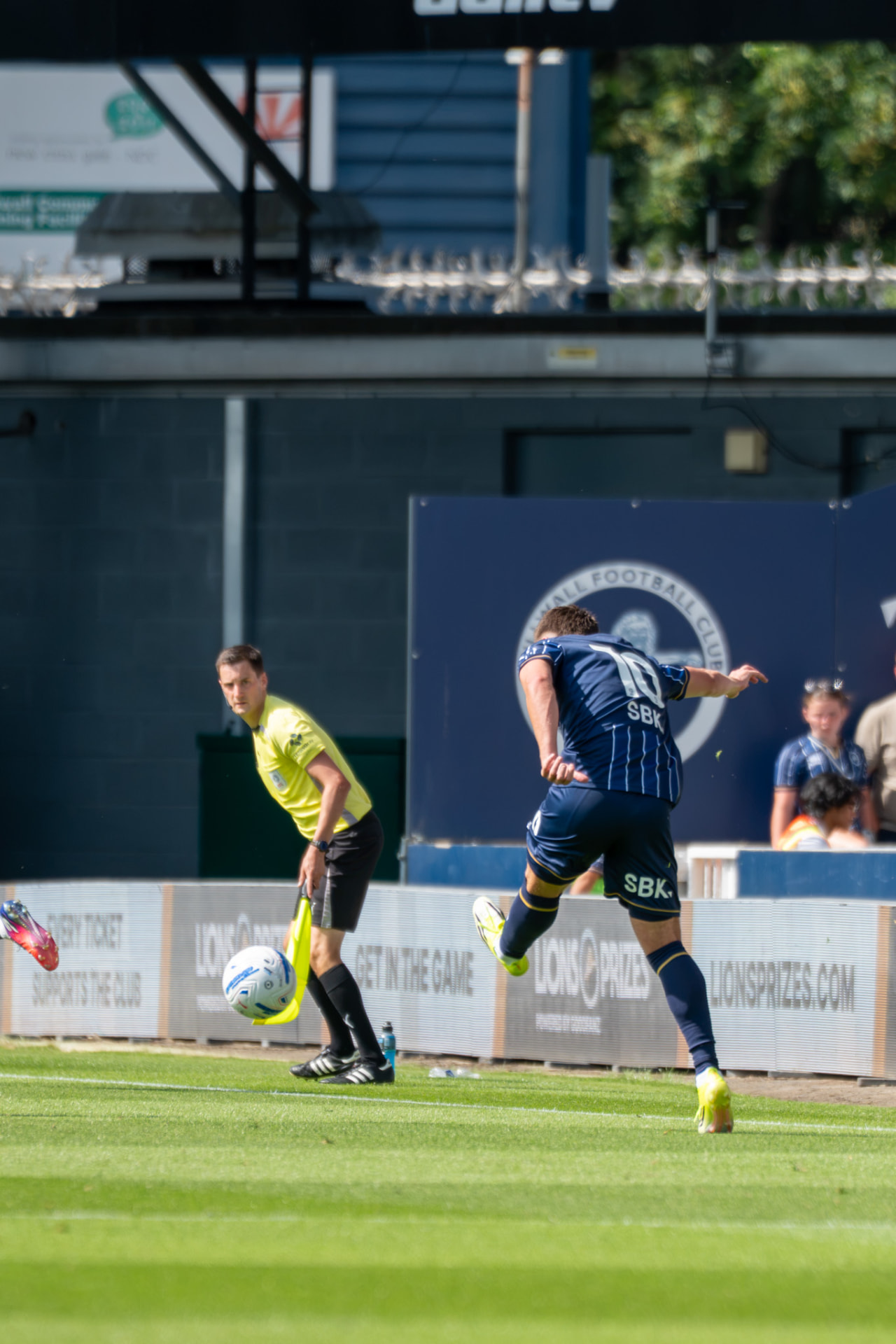 Millwall number 10 following through on a shot