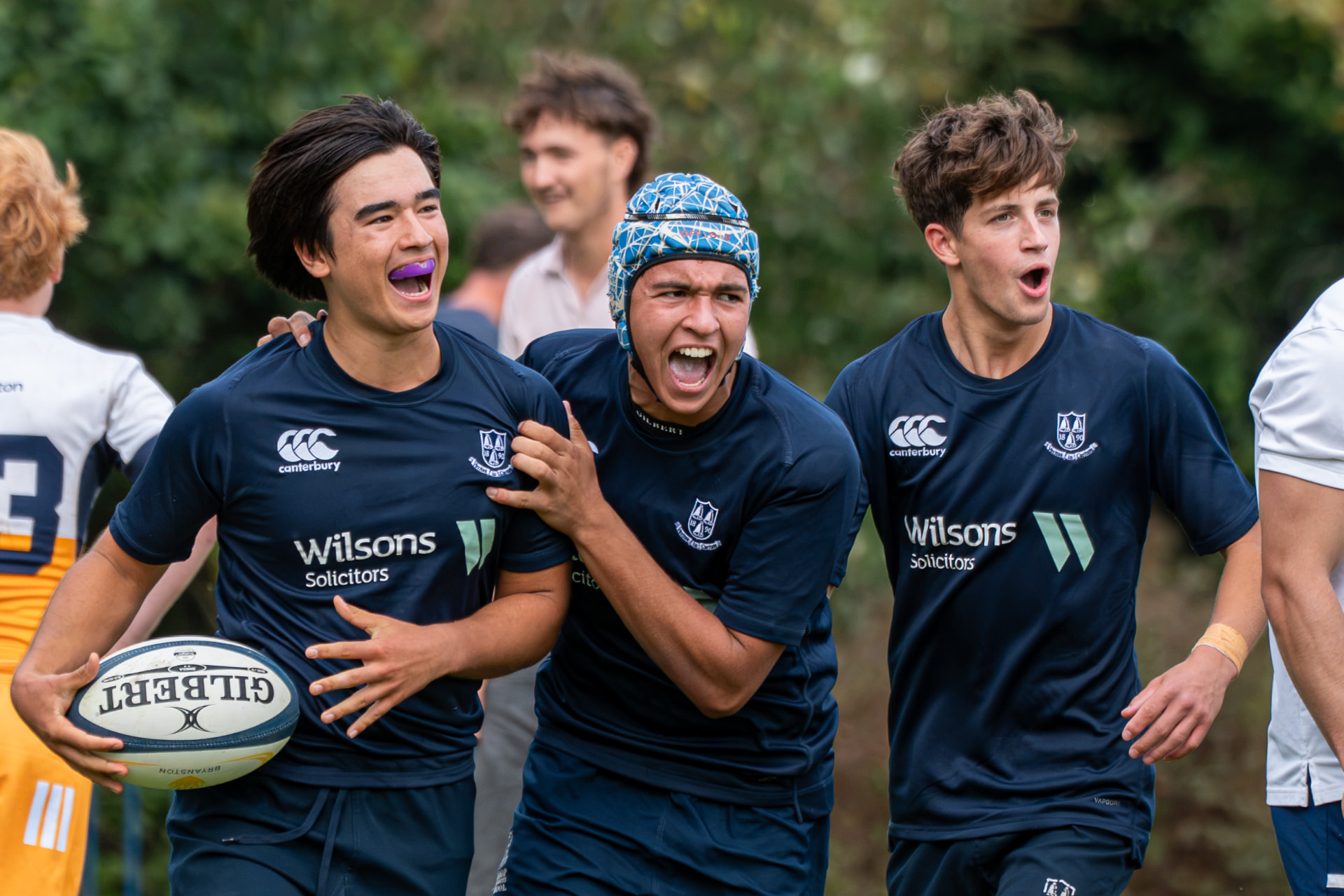Rugby players celebrating a try in full colour