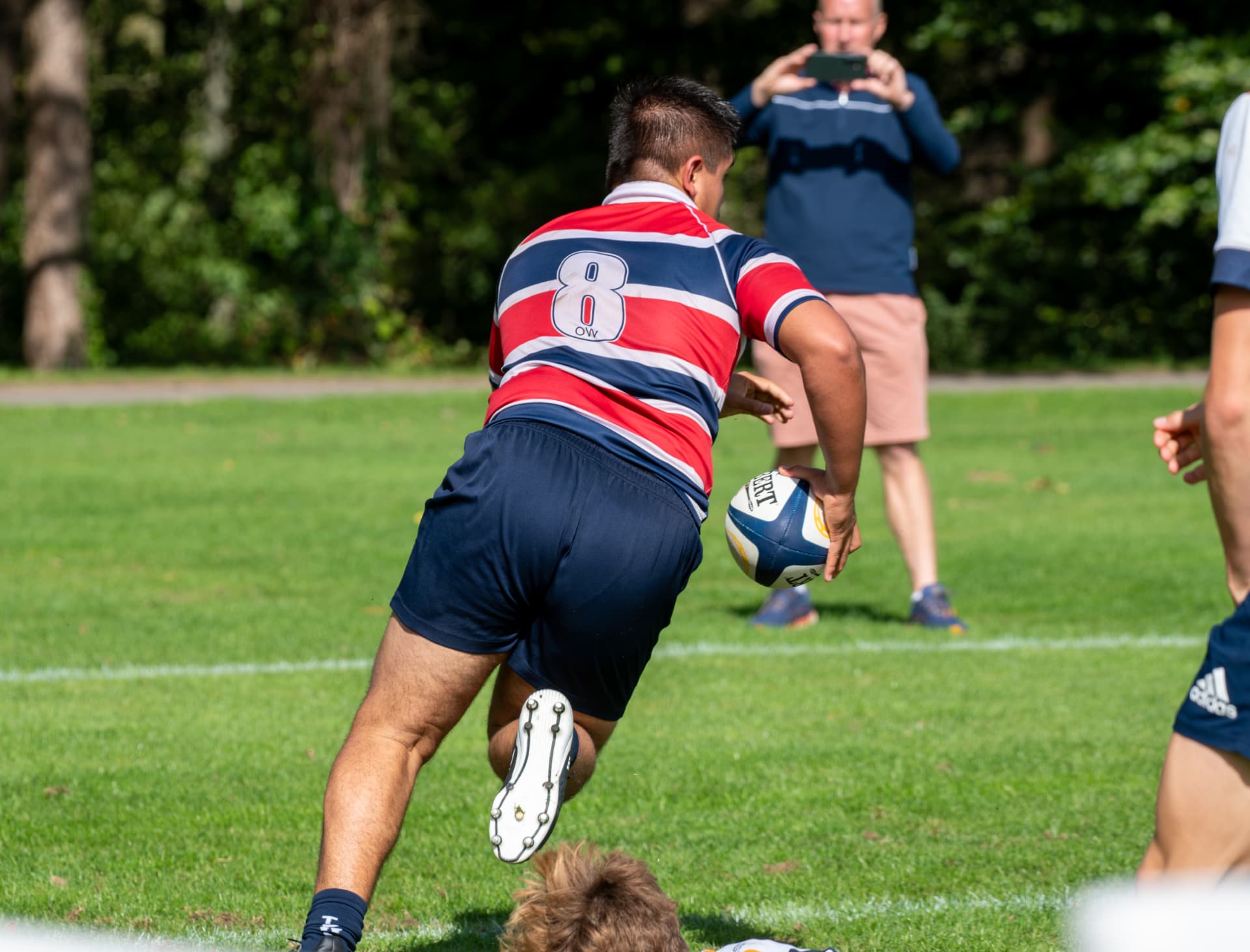 Rugby player running away with the ball