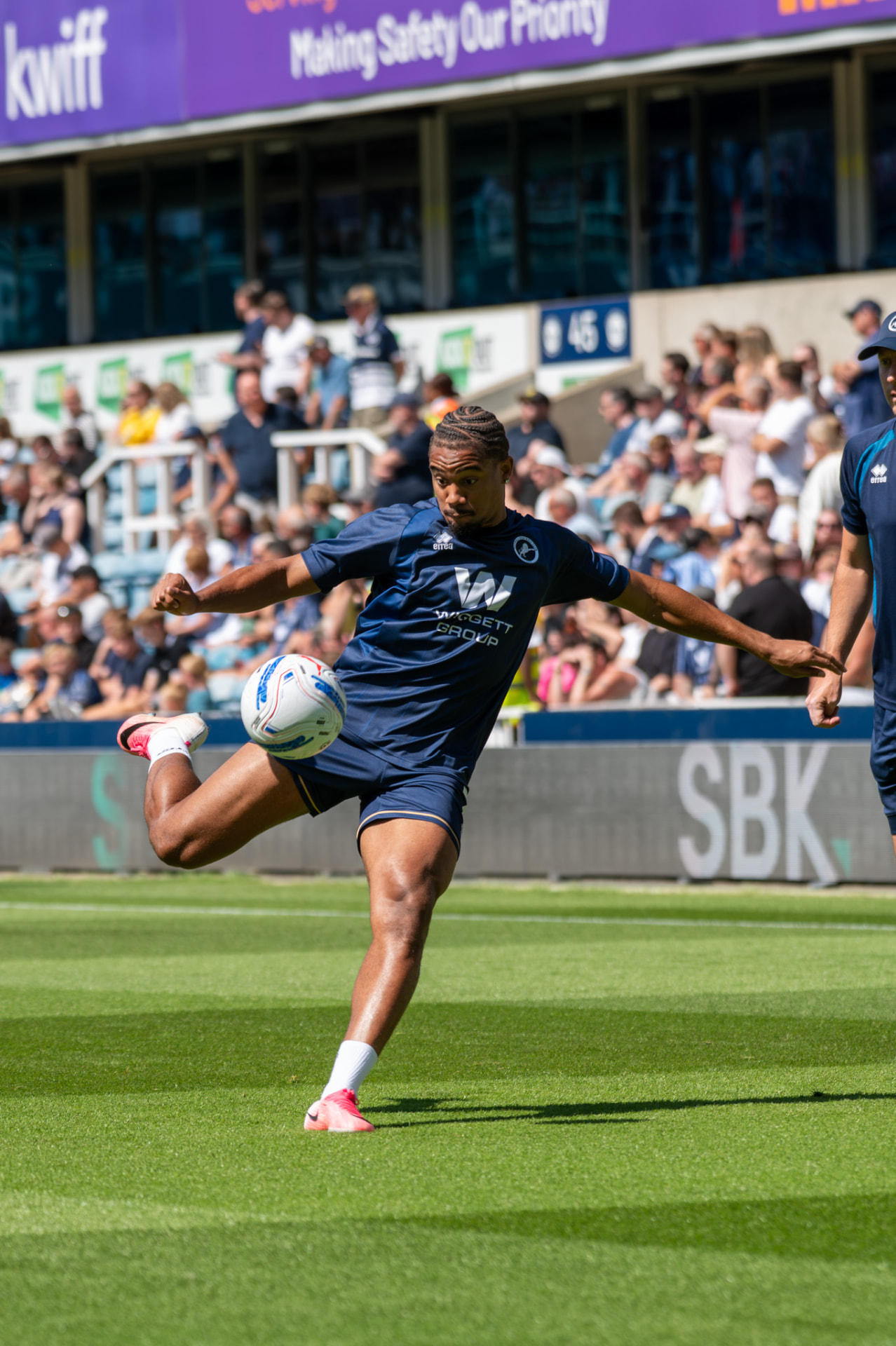 Player controlling the ball mid-air during the warm-up