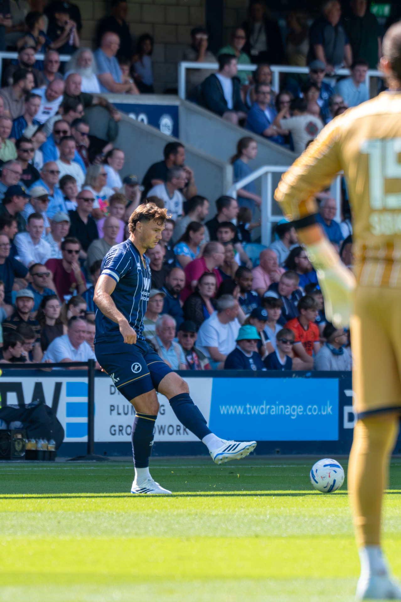 Player playing a short pass to a teammate