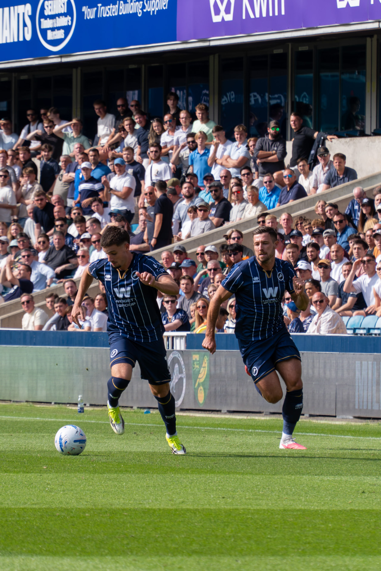 Two Millwall players breaking forward on the counter