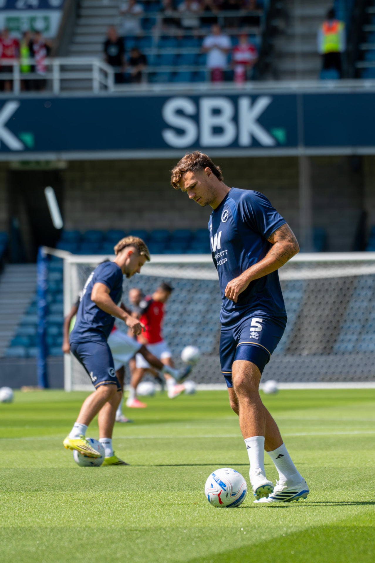 Defender on the ball during the pre-match warm-up