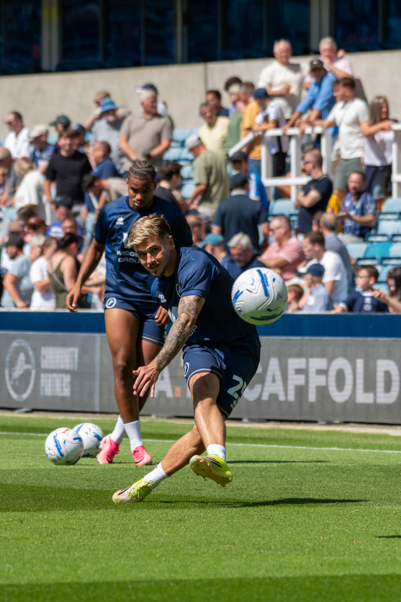 Player whipping in a cross during warm-up drills