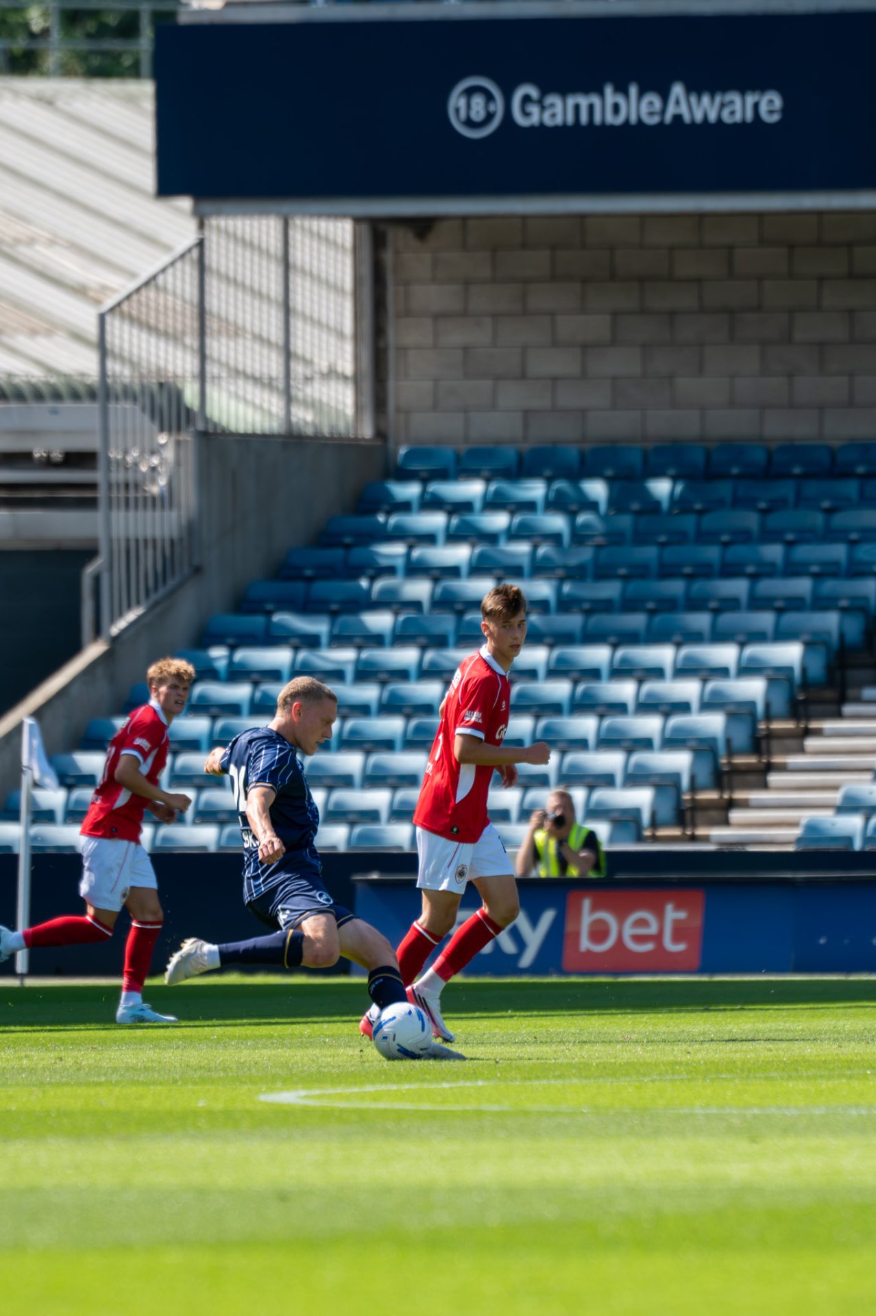 Player striking through the ball in an empty stand