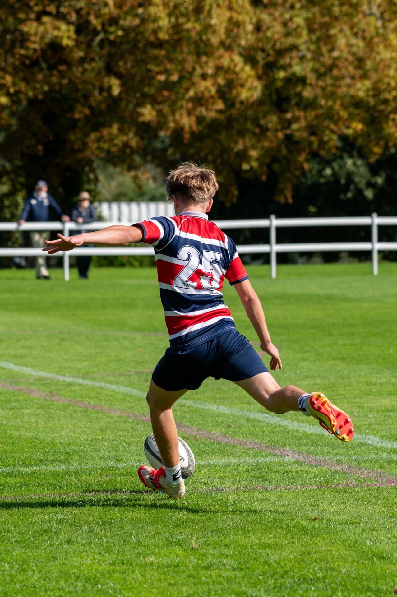 Rugby player kicking from the field