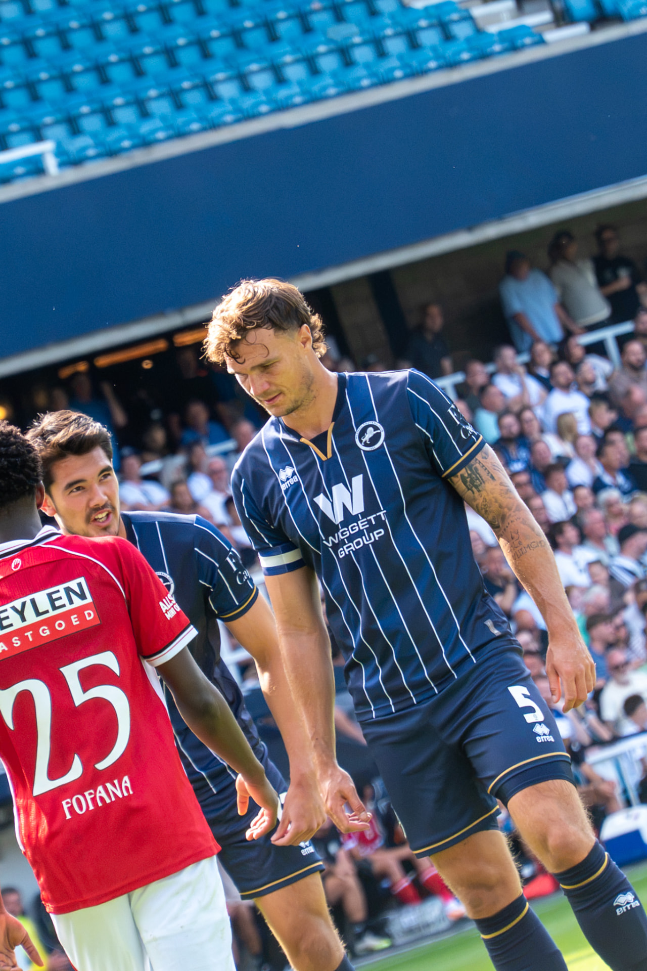 Millwall number 5 exchanging words with an opponent