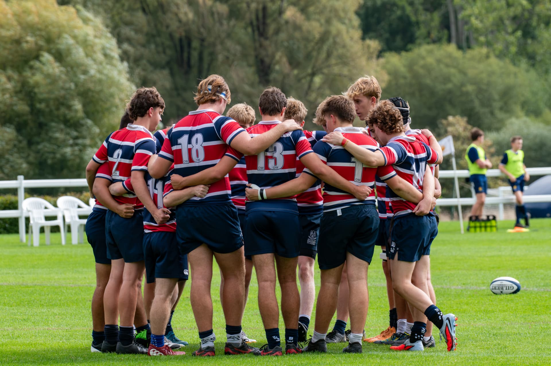 Rugby team gathered in a pre-match huddle