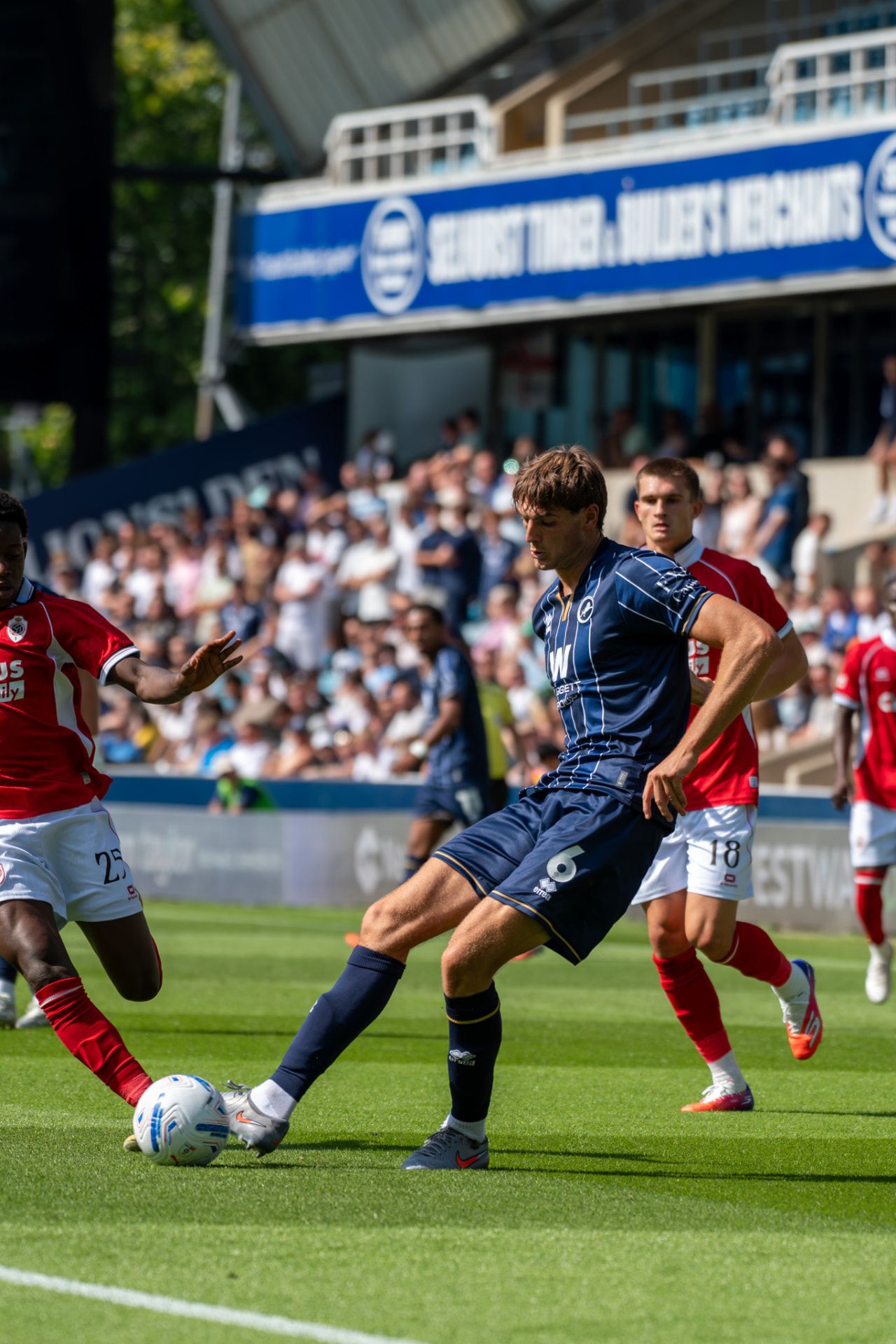 Millwall number 6 delivering a ball from wide