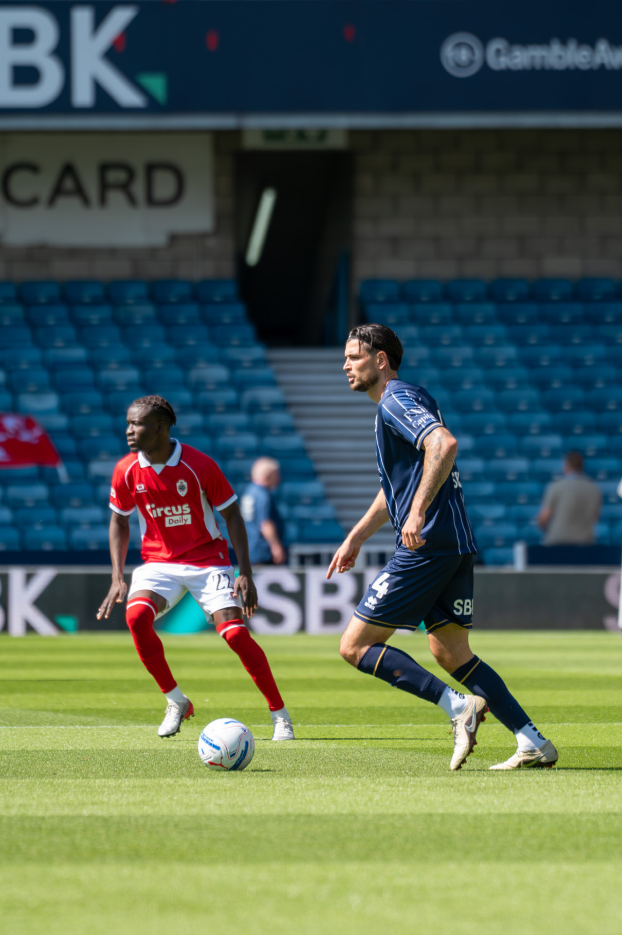 Defender carrying the ball out from the back