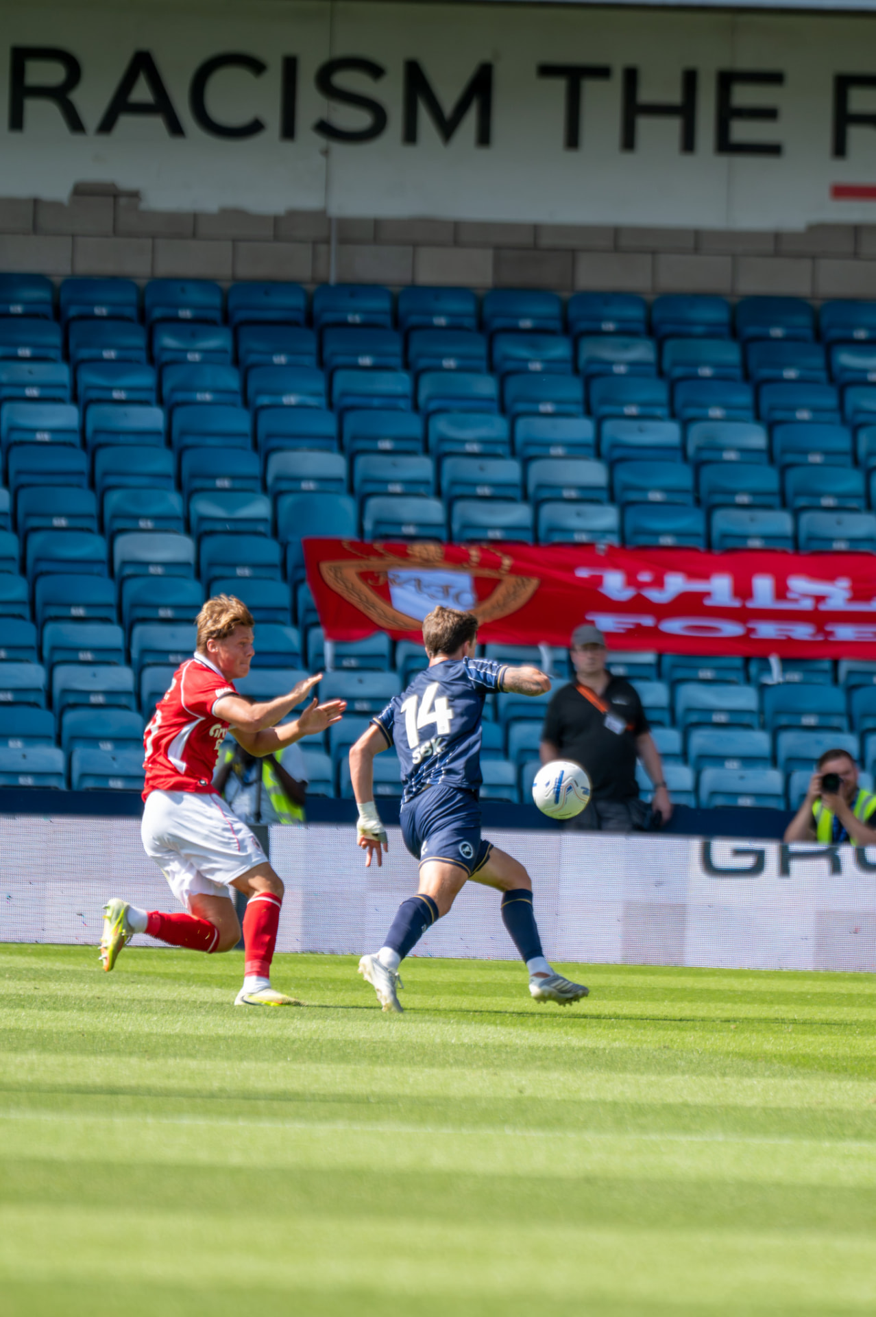 Millwall number 14 breaking past a defender