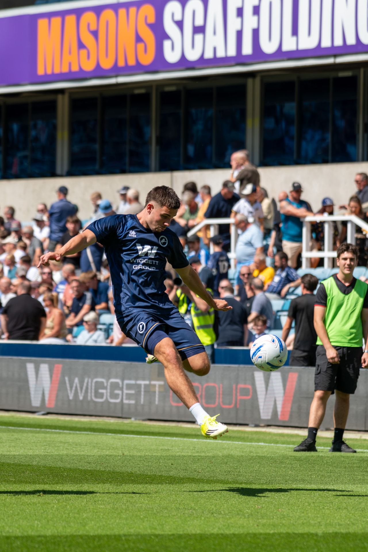 Player striking the ball in the pre-match warm-up