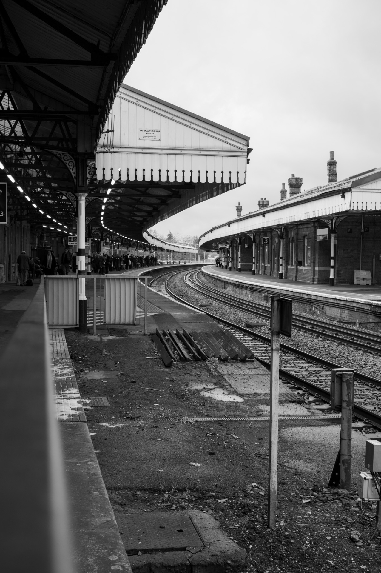 Empty Victorian railway platform curving into the distance