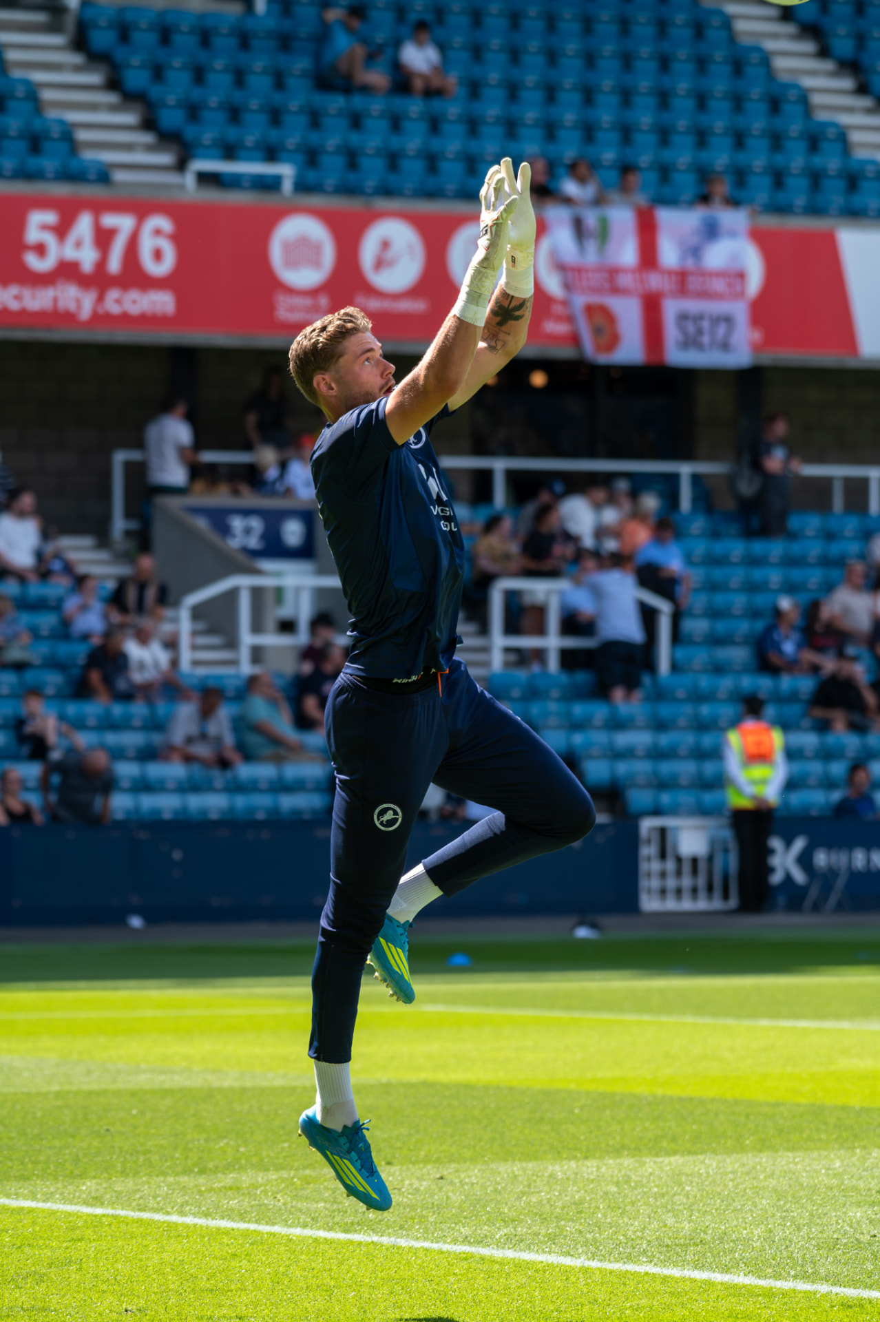 Goalkeeper leaping to claim a high ball
