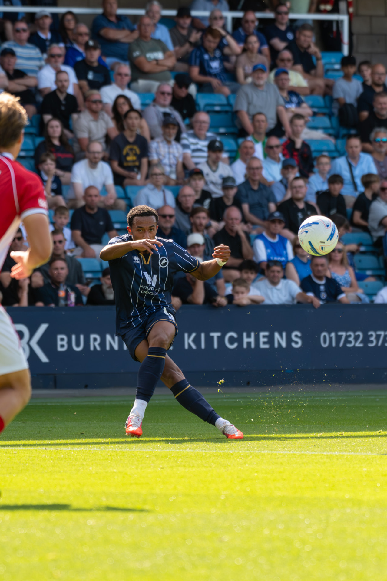 Player whipping a cross into the box
