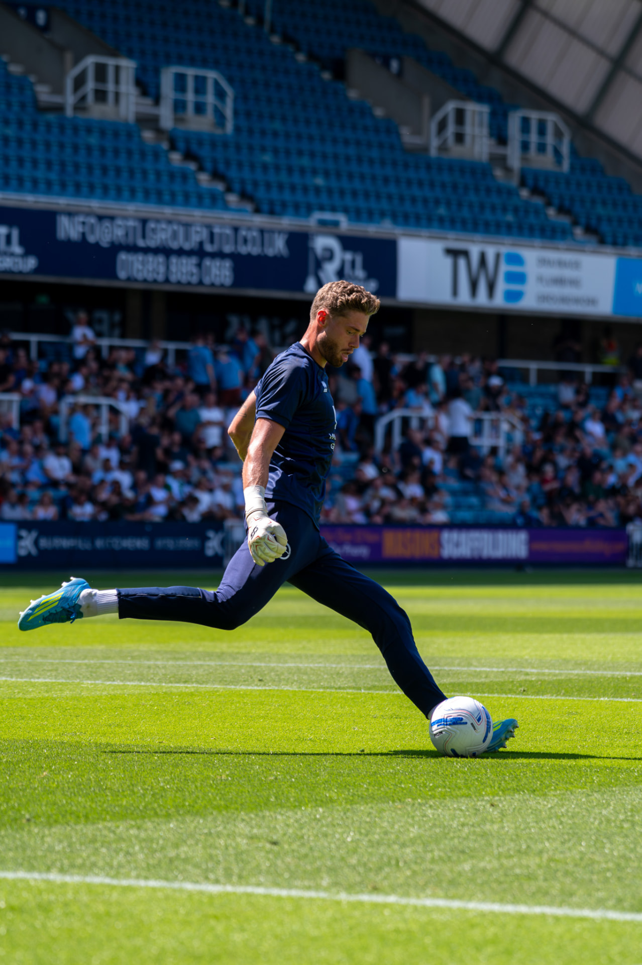 Goalkeeper striking a long ball from the edge of the box