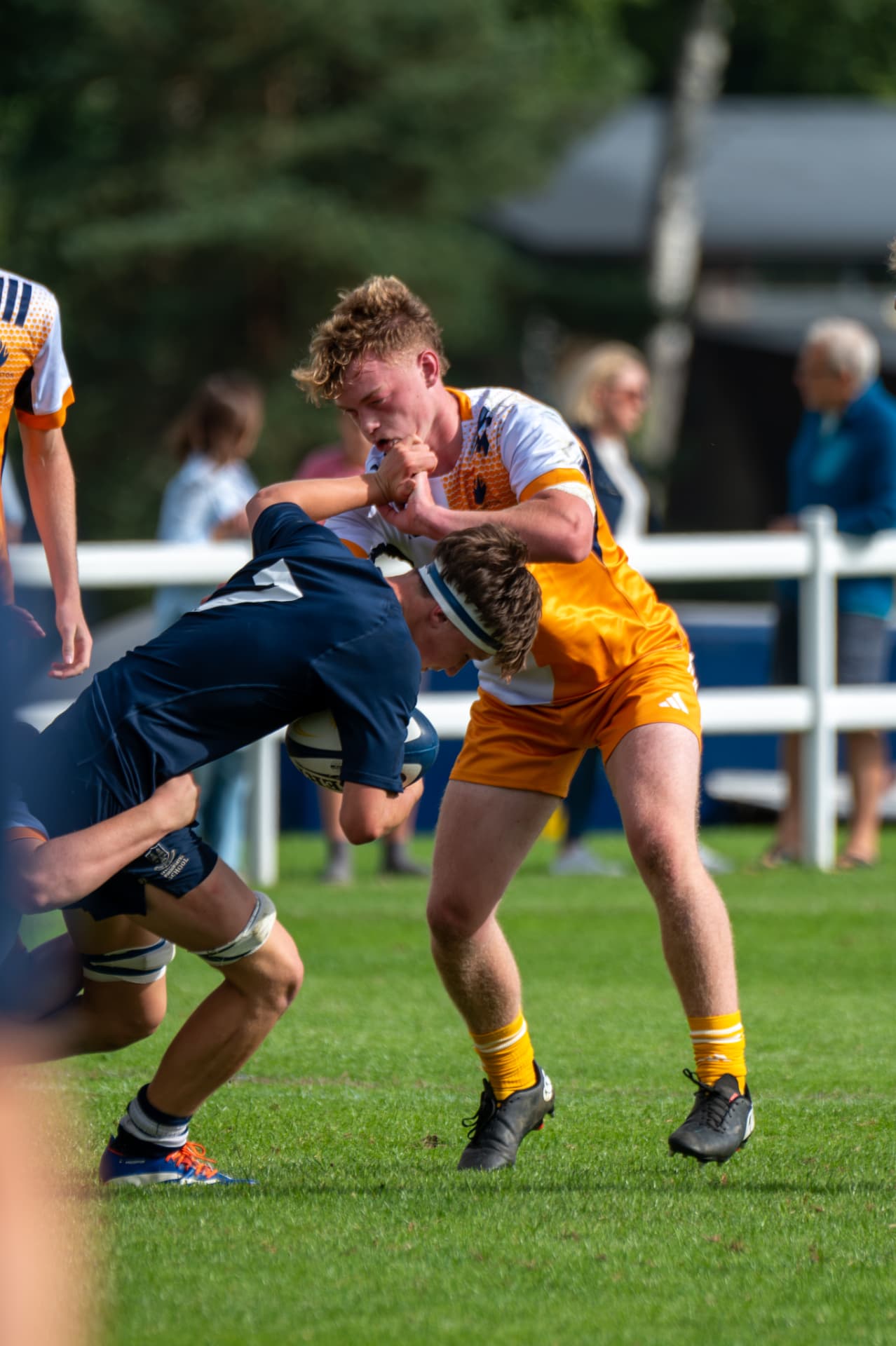 Rugby ball carrier meeting a defender in contact