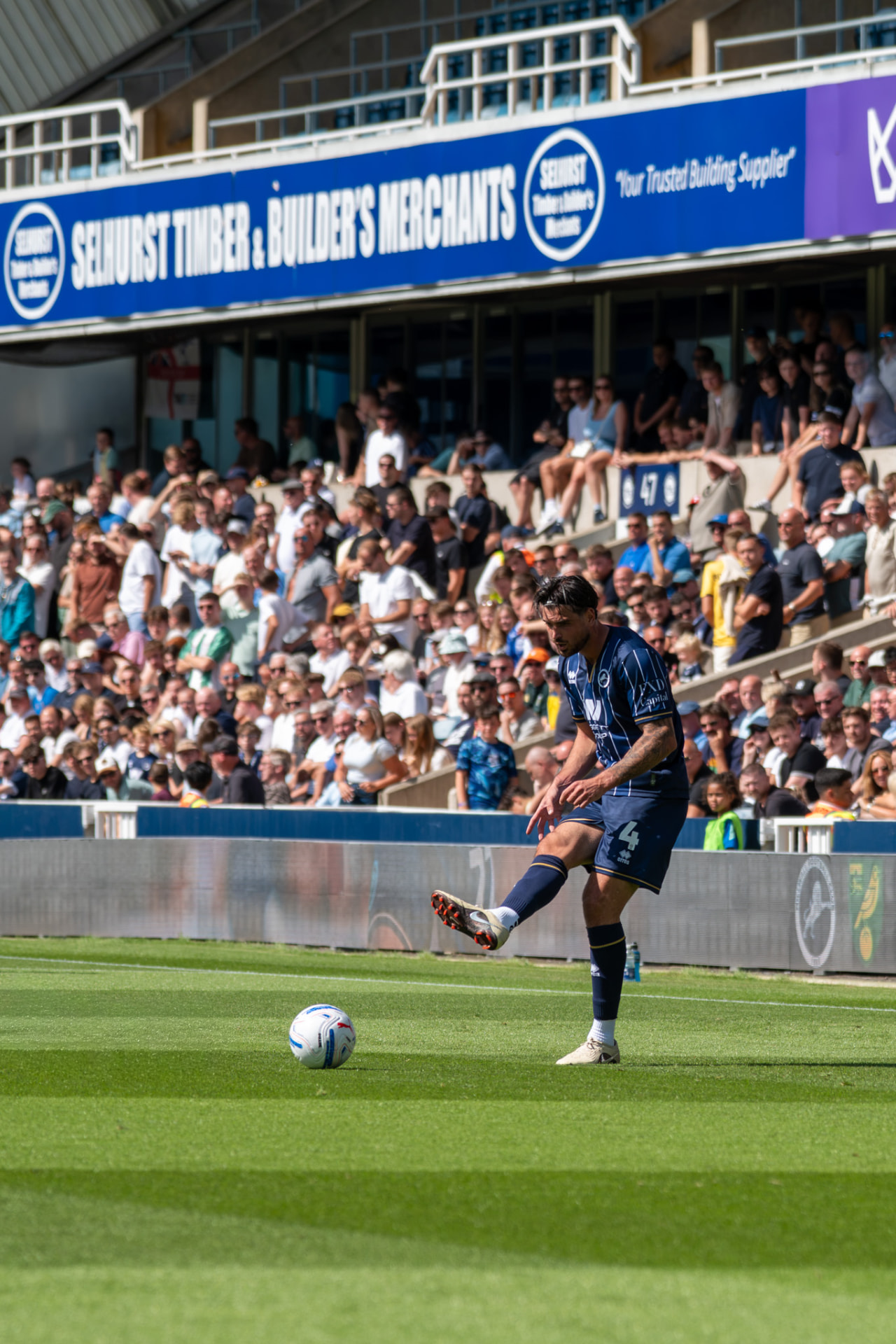Player clearing the ball from the touchline
